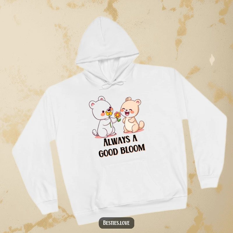 Funny hoodie with a cute animal giving a colorful flower to a laughing friend, representing warmth and thoughtful gestures.