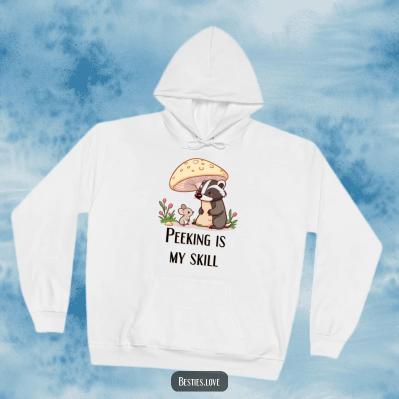 Funny hoodie depicting a shy mouse peeking from beneath a large mushroom at a proud badger, embodying gentle curiosity and forest charm.