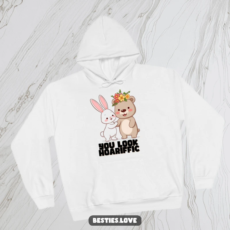 Funny hoodie depicting a cheerful bunny presenting a silly flower crown to a smiling bear, embodying friendship and playful charm.