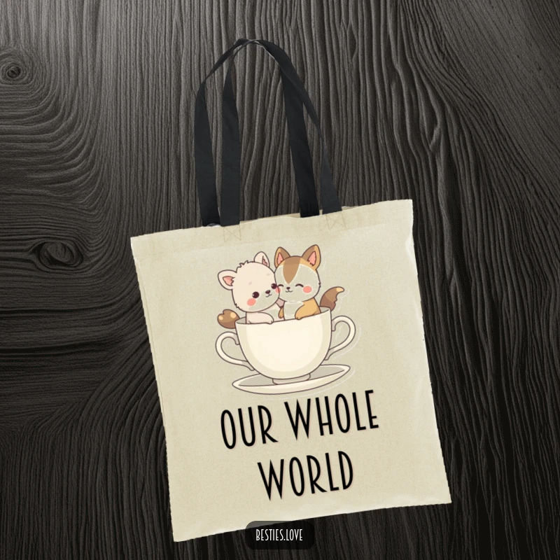 Funny Bestie Animals Tote Bag: Two inseparable companions comically fitting into a tiny teacup, showcasing a humorous take on companionship.